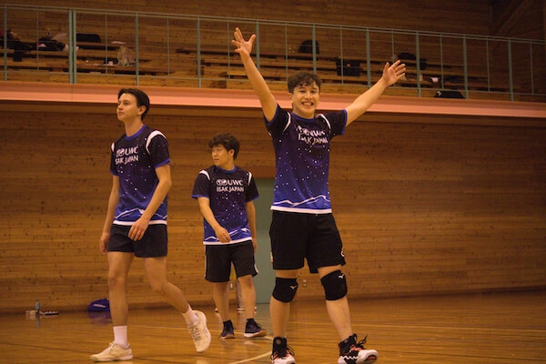 Three UWC ISAK Japan male volleyball team members