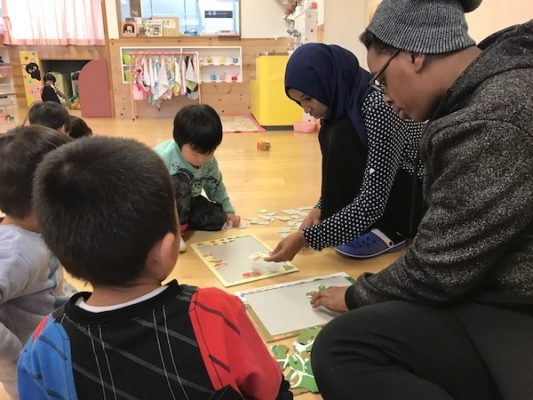 Denzel (Zimbabwe / Class of 2019) playing puzzle with sick Kids as part of his CAS project