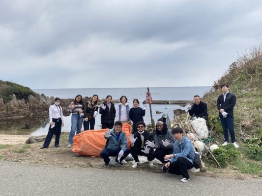 UWC ISAK Japan Nippon Foundation scholars beach cleaning during a school trip in Fukui prefecture