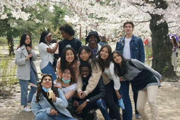 Junita (Liberia / Class of 2021) with her High School friends under a cherry blossom tree in Matsumoto, Japan