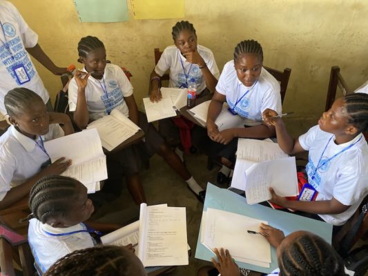 A group of young girls discussing sexual and reproductive health in Liberia