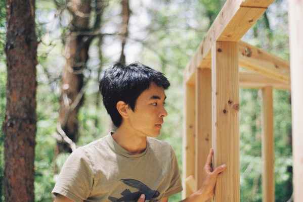 UWC ISAK Japan student Kai (Japan / Class of 2021) building a tree house in the forest surrounding campus for their CAS project