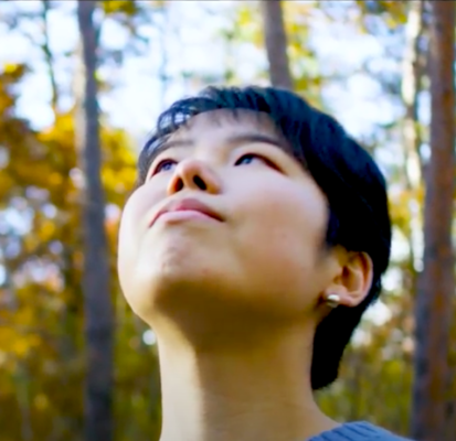 Manami, UWC ISAK Japan student (class of 2022) looking at the trees near campus