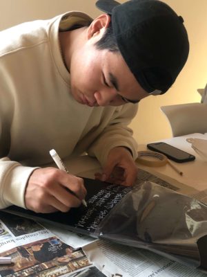 UWC ISAK Japant student Simon (New Zealand / Class of 2022) designing t-shirt