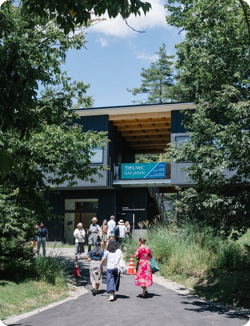 Visitors walking toward a UWC ISAK Japan campus building