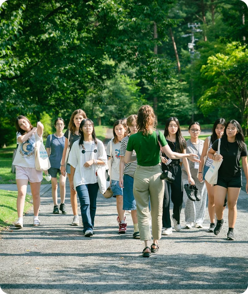 Students and visitors walking through the UWC ISAK Japan campus